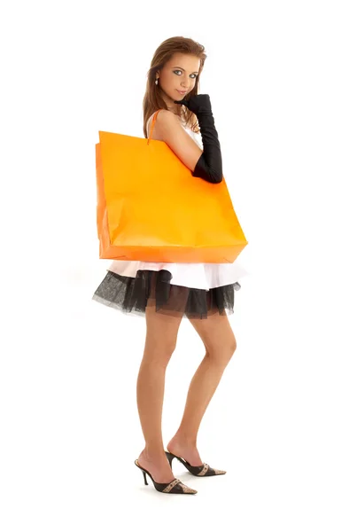 オレンジ色の買い物袋を持つエレガントな女性 — ストック写真