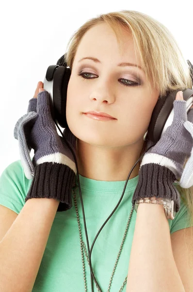 Teenage girl in headphones over white — Zdjęcie stockowe