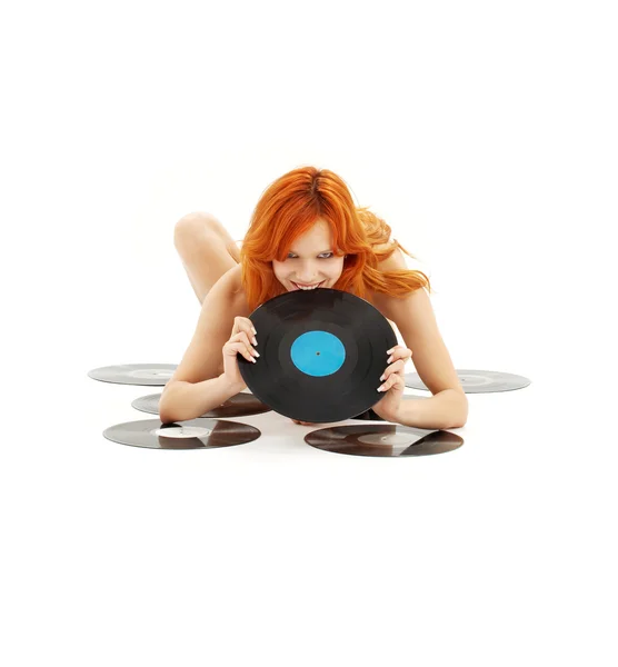 Speelse roodharige met vinyl records — Stockfoto