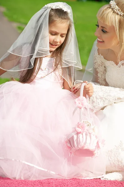 stock image Happy bride and little bridesmaid