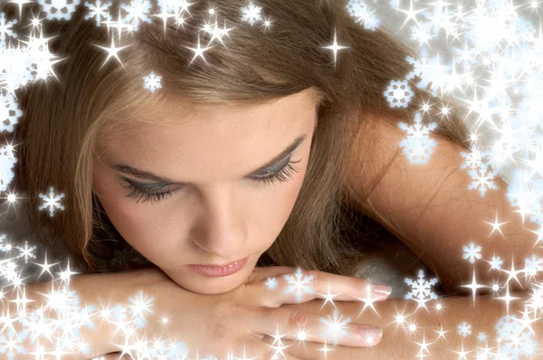 Thoughtful girl with snowflakes — Stock Photo, Image