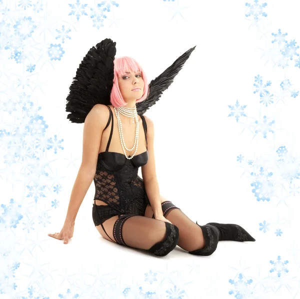 Black lingerie angel with pink hair and snowflakes — Stock Photo, Image