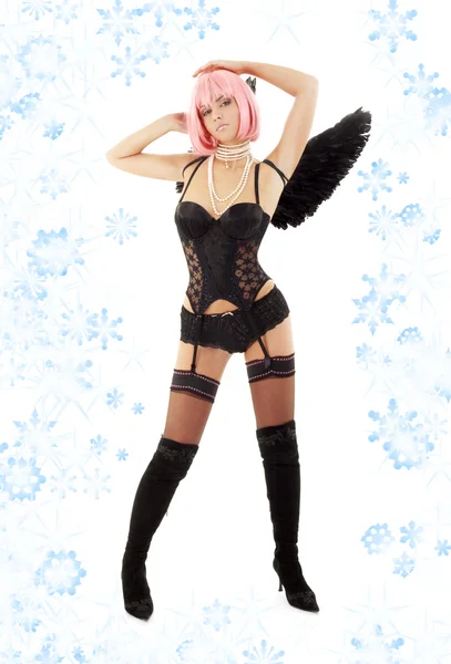 Dancing black lingerie angel with pink hair and snowflakes — Stock Photo, Image