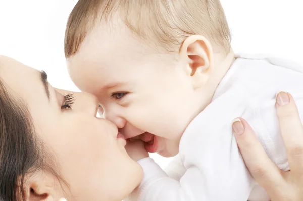 Happy mother kissing baby boy — Stock Photo, Image