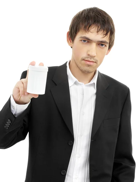 Confident man showing blank medication container — Stock Photo, Image