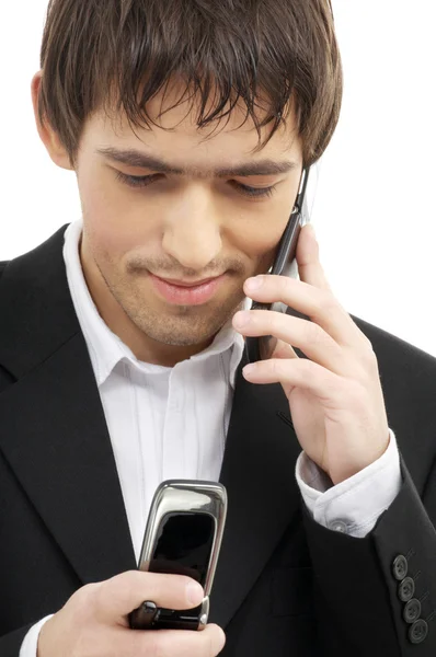 Uomo d'affari con due telefoni cellulari — Foto Stock