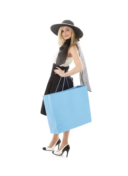 Blond in retro hat with blue shopping bag — Stock Photo, Image