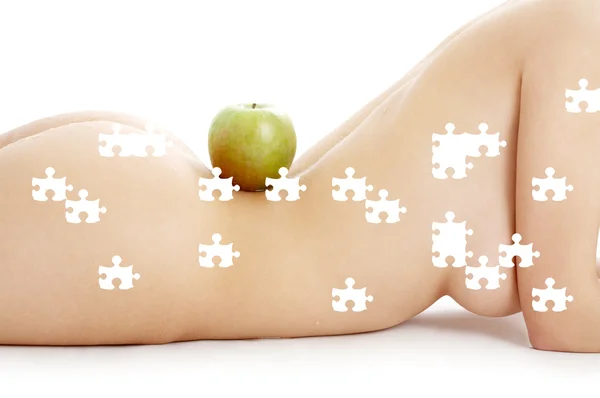 Puzzle of woman torso with green apple — Stock Photo, Image