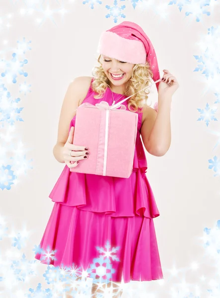 Cheerful santa helper girl with gift box — Stock Photo, Image