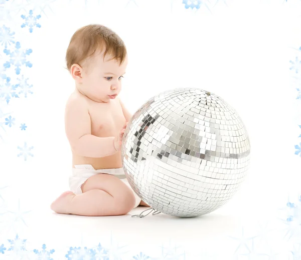 Baby boy with big disco ball — Stock Photo, Image
