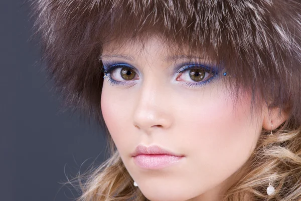Lovely woman in furry hat — Stock Photo, Image