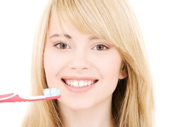 Glad tjej med tandborste — Stockfoto