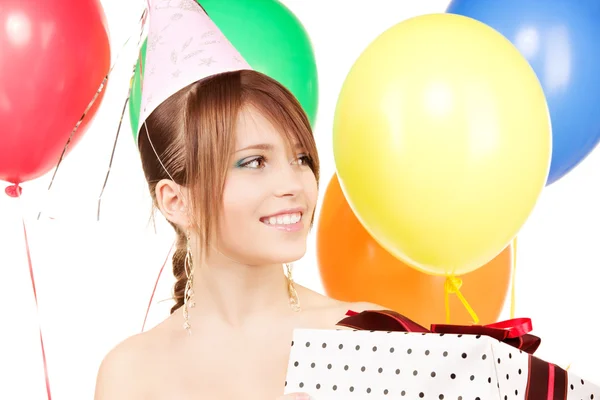 Party girl with balloons and gift box Stock Photo