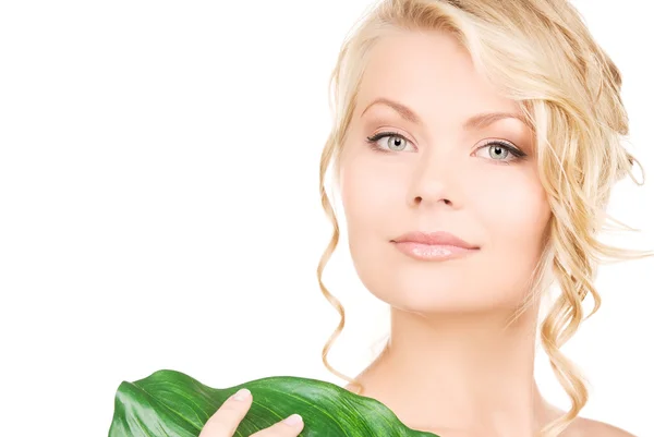 Woman with green leaf Royalty Free Stock Images