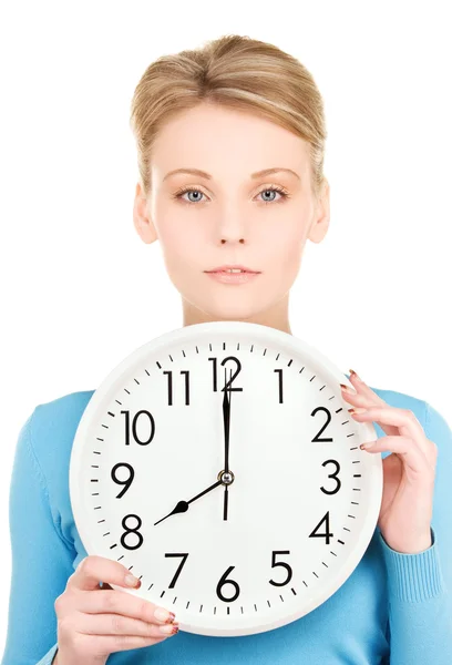 Женщина держит большие часы Лицензионные Стоковые Фото