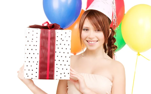 Party girl with balloons and gift box Royalty Free Stock Photos