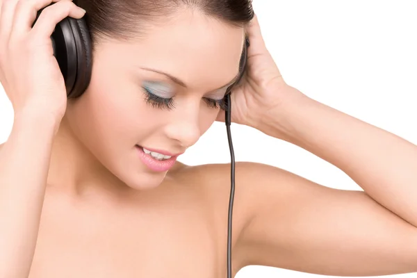 Happy woman in headphones Stock Image