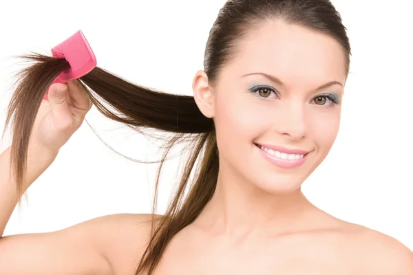 Woman with comb Stock Image