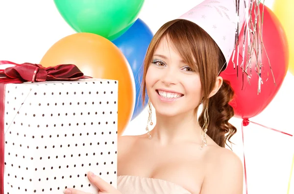 Partygirl mit Luftballons und Geschenkbox lizenzfreie Stockfotos