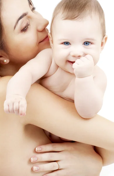 Clean happy baby in mother hands Stock Picture