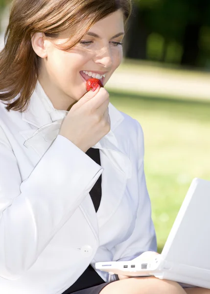 Business lady with strawberry Royalty Free Stock Images