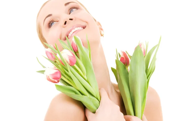 Šťastná žena s květinami — Stock fotografie