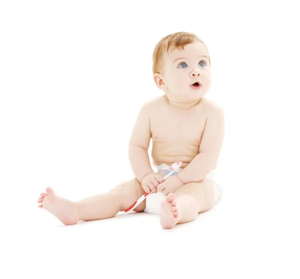 Bambino in pannolino con spazzolino da denti — Foto Stock