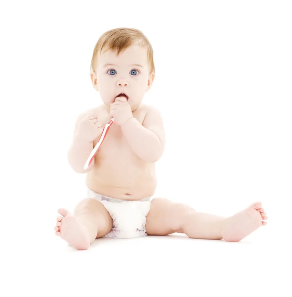 Дитячий хлопчик в підгузник з зубною щіткою — стокове фото