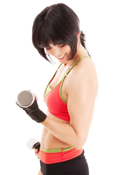 Muskulöser Fitnesstrainer mit Kurzhanteln — Stockfoto