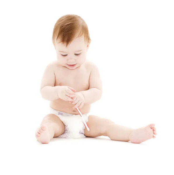 Bebek çocuk bezi ile diş fırçası — Stok fotoğraf