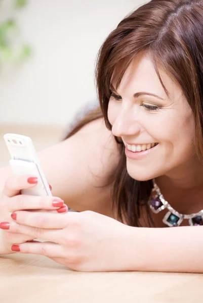 Woman with white phone — Stock Photo, Image