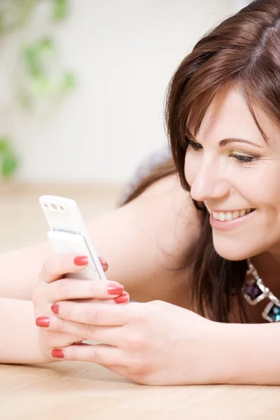 Woman with white phone — Stock Photo, Image