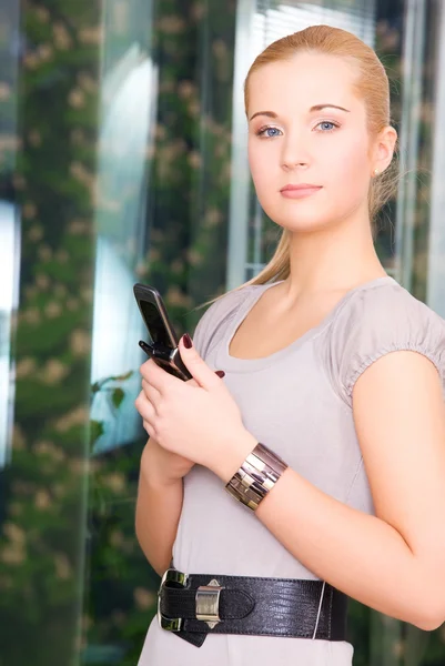 Lovely woman with cell phone — Stock Photo, Image