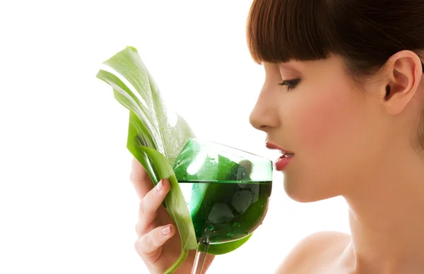 Woman with green leaf and glass of water — Stock Photo, Image