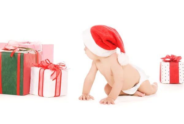 Santa helper baby with christmas gifts — Stock Photo, Image