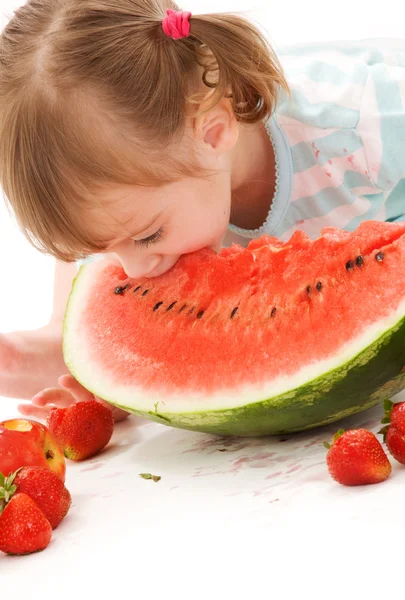 Little girl with strawberry and watermelon — Stock Photo, Image