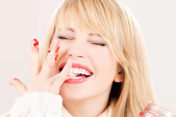Happy teenage girl with raspberry jam — Stock Photo, Image
