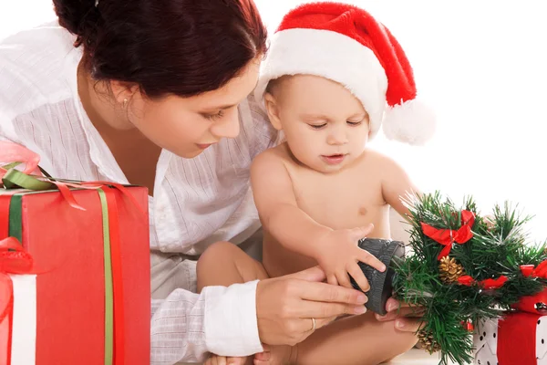 Baby and mother with christmas gifts — Stock Photo, Image