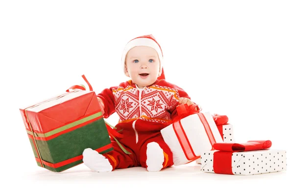Weihnachtsmann-Helferbaby mit Weihnachtsgeschenken — Stockfoto