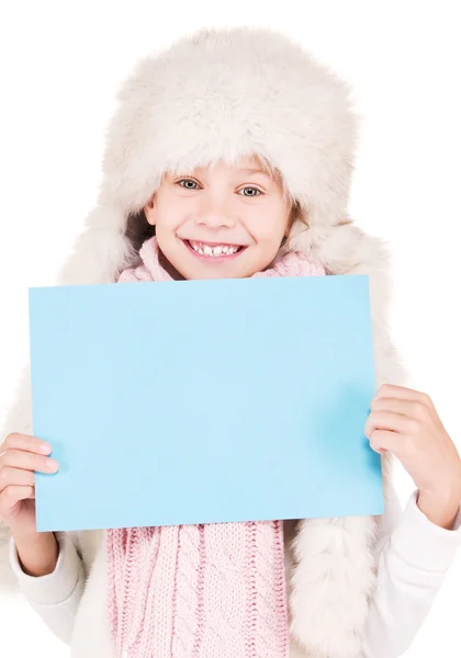 Girl in winter hat with blank board — Stock Photo, Image