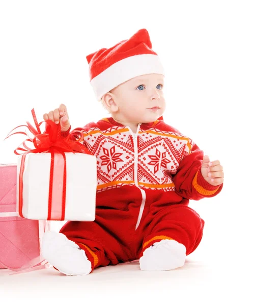 Santa helper barnet med julklappar — Stockfoto