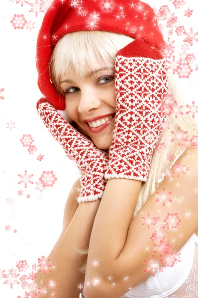 Santa helper girl with snowflakes — Stock Photo, Image