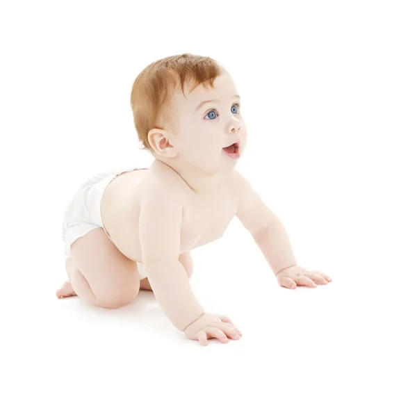 Crawling baby boy in diaper Stock Image