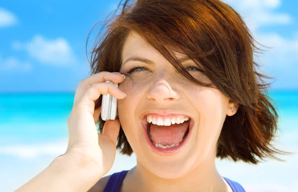 Happy woman with cell phone Stock Picture