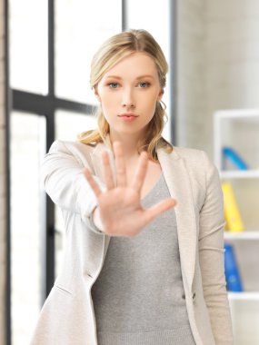 Young woman making stop gesture clipart