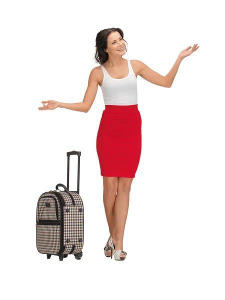 Щаслива жінка з валізою привітання — стокове фото