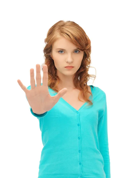 Młoda kobieta robi gest zatrzymania — Zdjęcie stockowe