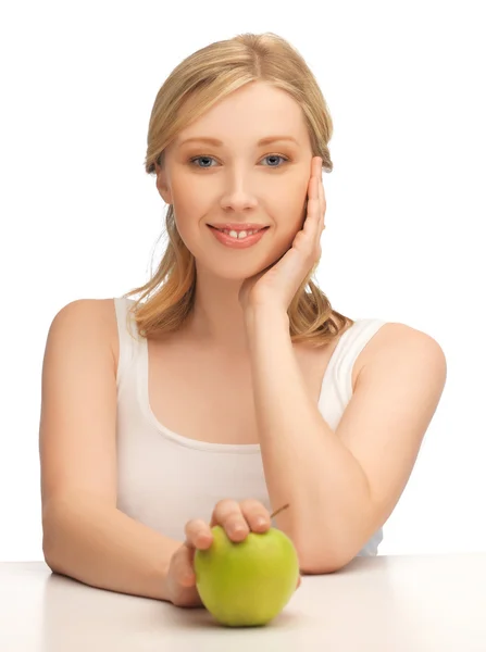 Nő zöld almával Stock Fotó