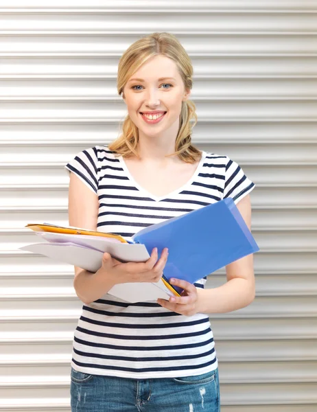 Happy teenage girl with books and folders — Stock Photo, Image