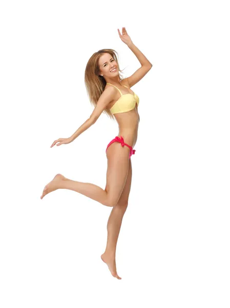 Bikinili kadın jumping resim — Stok fotoğraf